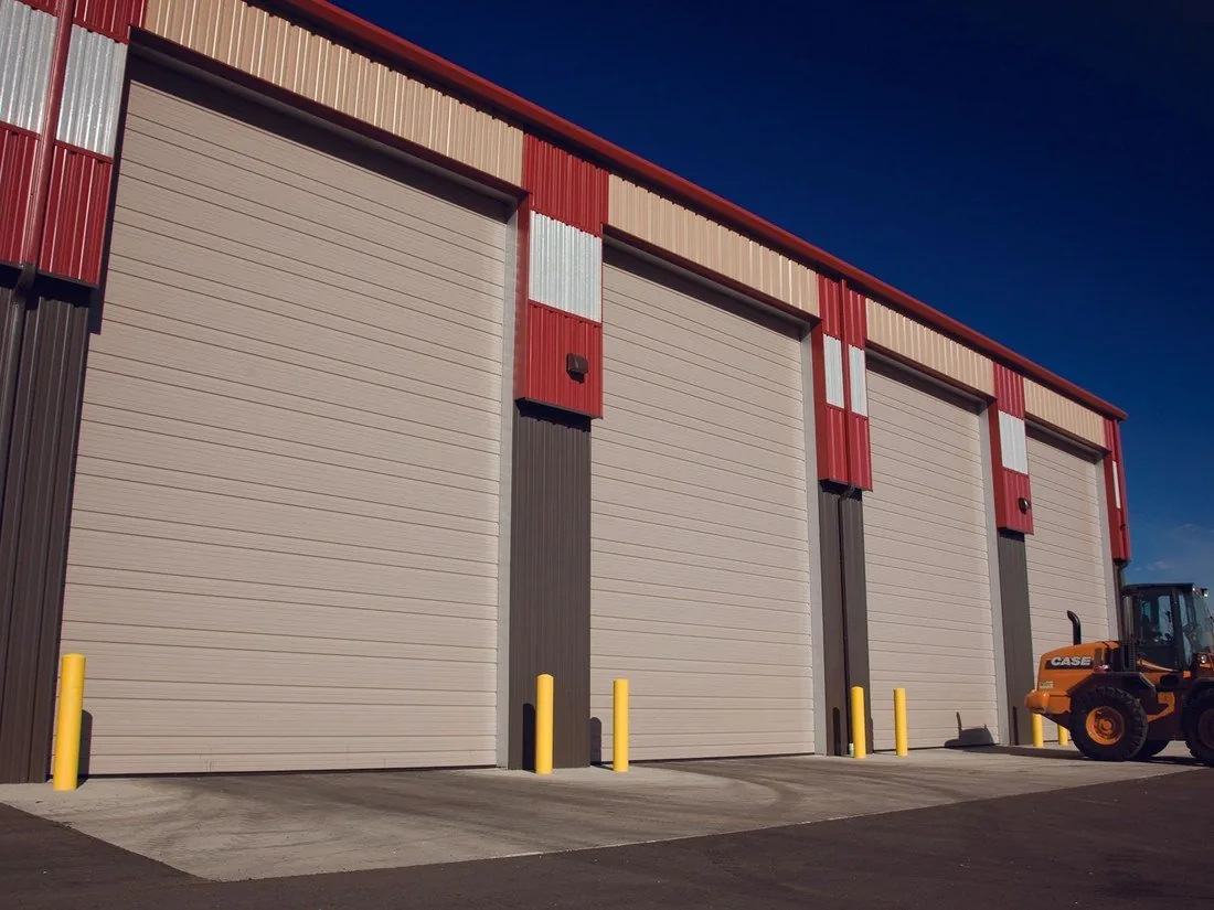 Sandstone insulated overhead doors on a steel farm shop