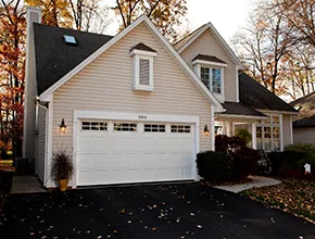 White carriage-style garage door on a home