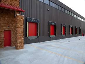 Commercial roll-up dock doors on an industrial building