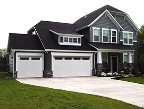 White garage doors on a custom home