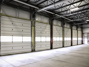 Insulated sectional dock doors inside a warehouse